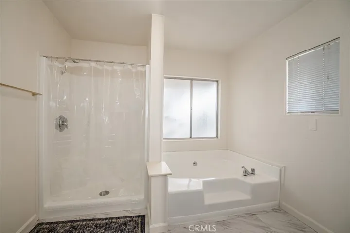 Primary restroom sunken tub and shower