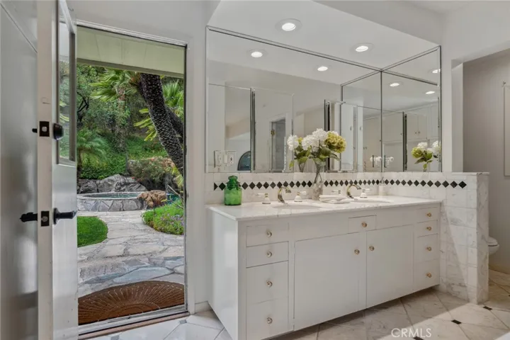Primary bath opens to pool