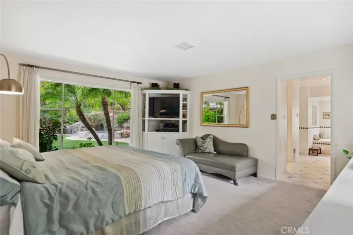 Primary bedroom with pool view