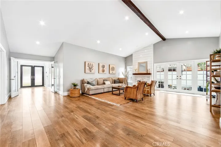 Living room looking towards the front door and French doors to side yard.