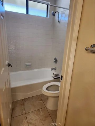Bathtub and toilet with door for privacy