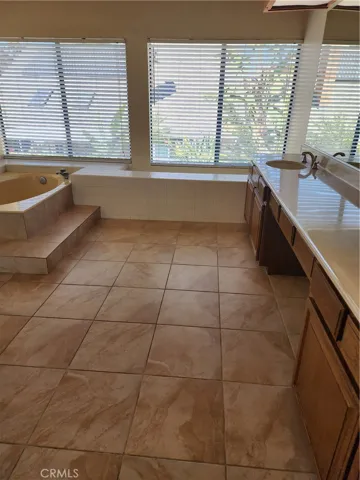 Huge upstairs  master bath with oversized tub and huge double vanity