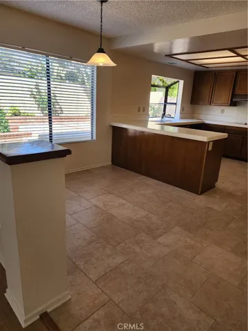 Breakfast or  informal dining area adjoins the big spacious kitchen. Lots of space and possiblities for Open kitchen concept.