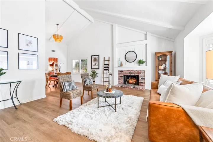 Vaulted ceilings cozy fireplace in the living room.
