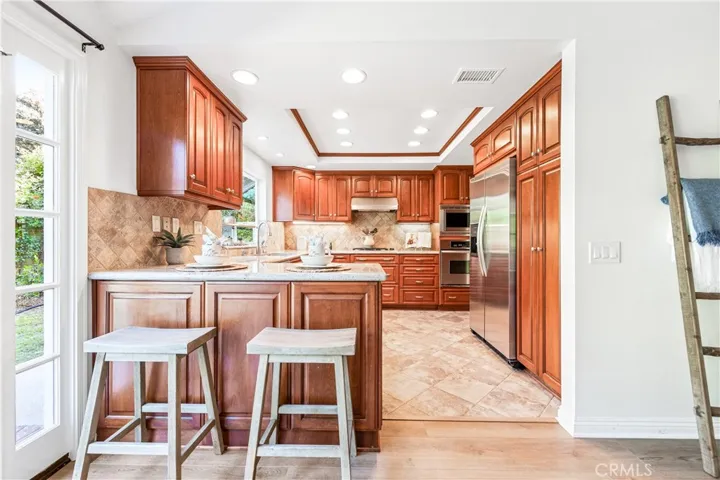 The kitchen has a lovely view of the back yard.