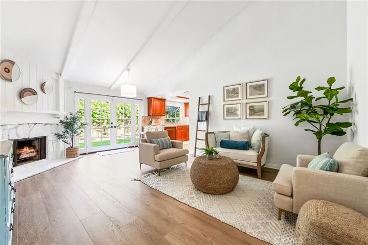 Family room is spacious with vaulted ceiling.