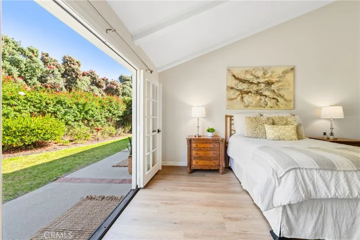 Primary bedroom with the French doors open.