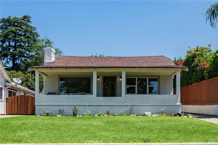 Front of house with wide covered porch
