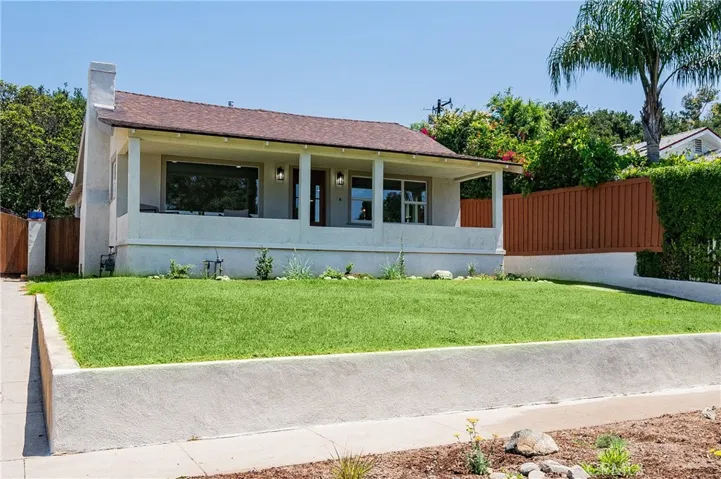 Corner view of the house with wide covered porch