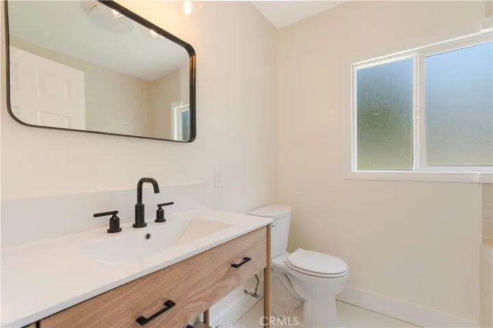 Remodeled bathroom with new vanity and fixtures