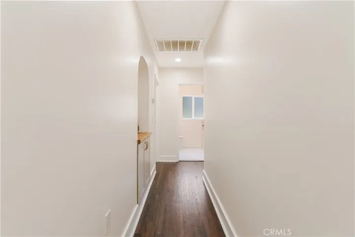 Hallway with arched inlet for storage