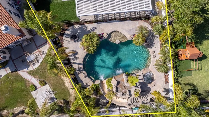 Impressive Custom 10 Ft deep Pebble Tech Pool Featuring Cascading Water Falls