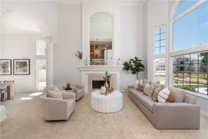 Formal Living Room Boasting Marble- Faced Fireplace