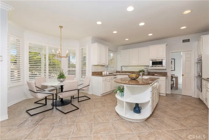 Sunny Breakfast Nook with Window Wood Shutters