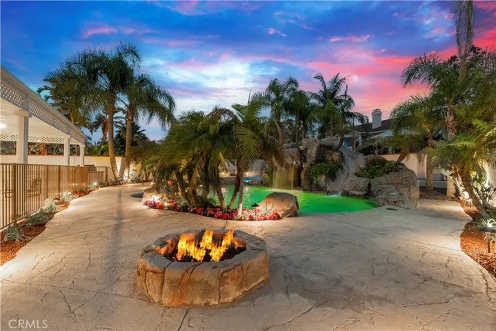 Tropical Landscape Surrounds the Pool with Fire Pit