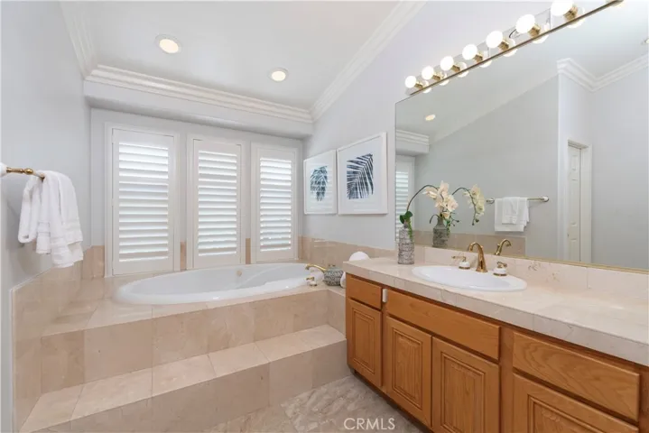Master Bathroom with Marble-Surrounded Tub