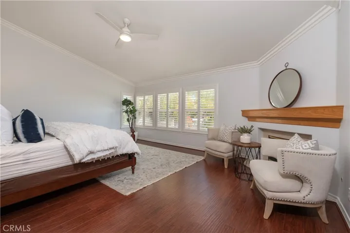 Master Bedroom with Lighted Celling Fan, Fire Place & Shutters and Cathedral Ceiling