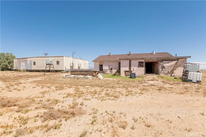 Manufactured structure on left and old saloon/store on right