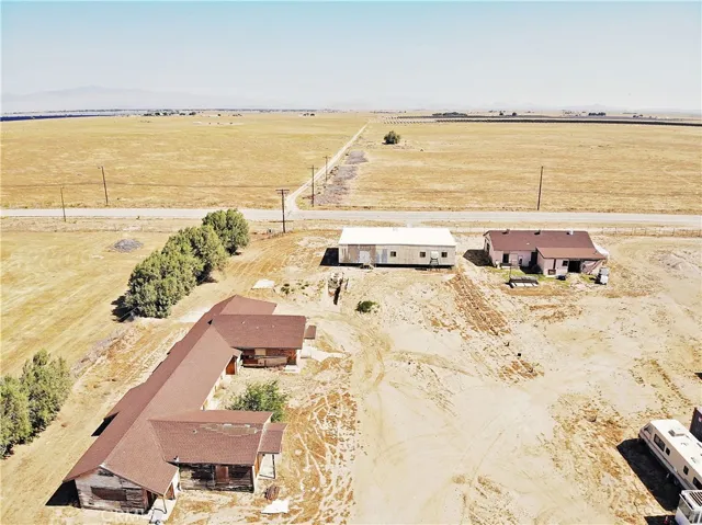 Facing North and includes Ranch House/Lodge, Manufactured structure, detached saloon/store on far right