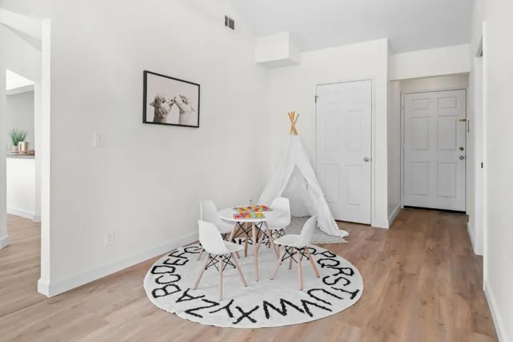 Play area in family room-door leads to inside laundry area