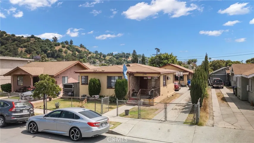 Each house is large in size and front house can be delivered Vacant . Each with laundry hook ups , garage and back yard ! Lot is 7500