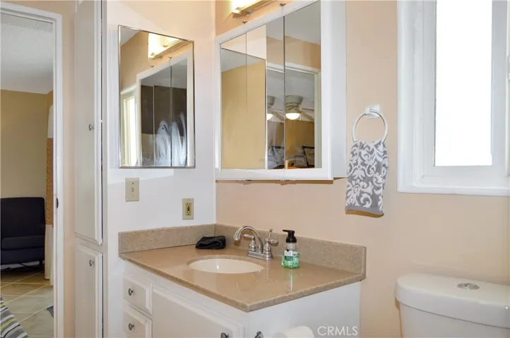 The main suite's bath has been upgraded with a custom, tiled, walk-in shower with a Vevor shower panel system with waterfall and massage jets
