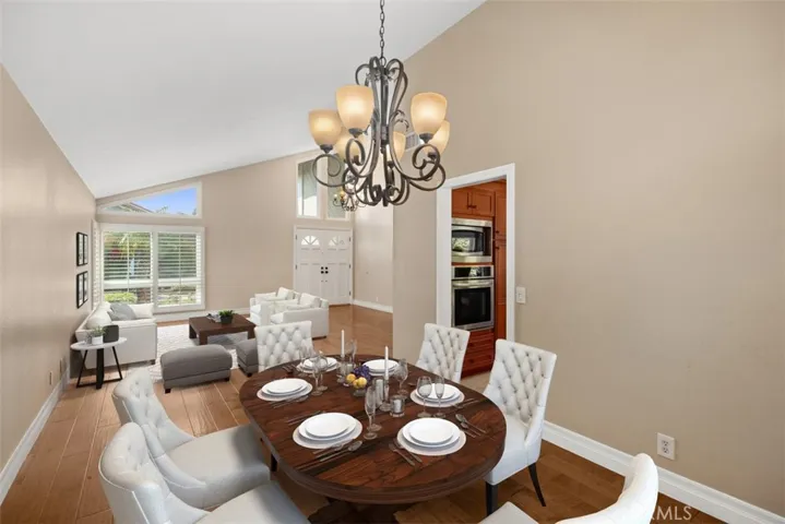 Lovely dining room and open floor plan with the living room.
Note: Photo is virtually staged.
