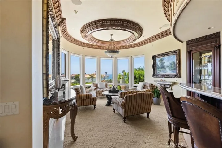 Wet Bar and Sitting Area with lovely windows to take in those ocean views!