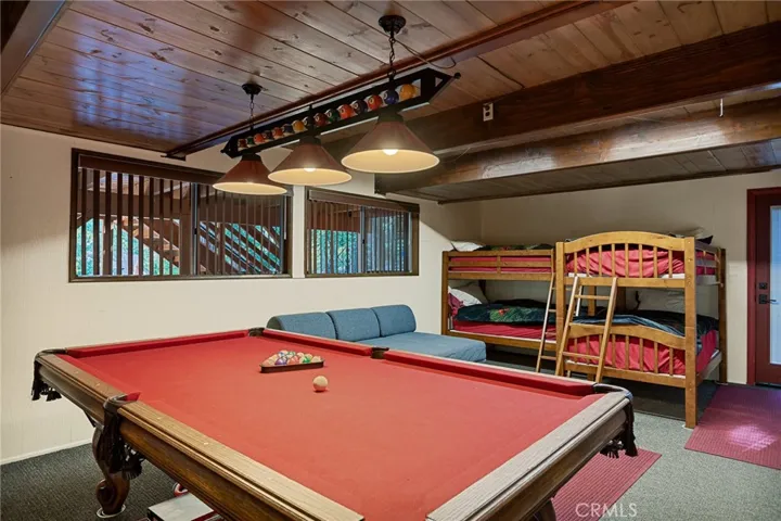 Super Fun Gameroom Downstairs with Plenty of Room for Bunkbeds and Lounging!