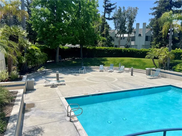 Left side of main community pool and spa with relaxation area.