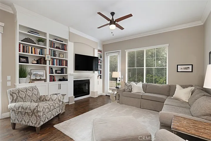 Fireplace and built-in bookshelves in family rom.