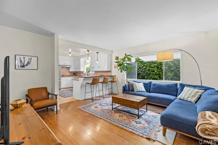 Living room opens to kitchen