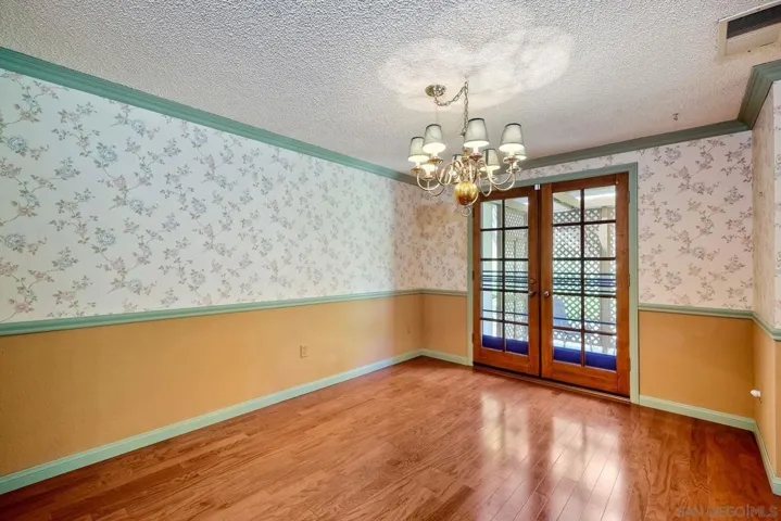 Separate dining room with views to french doors leading to private patio area