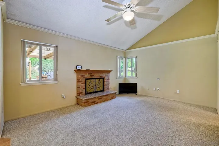 Large family room off the kitchen with wood burning fireplace