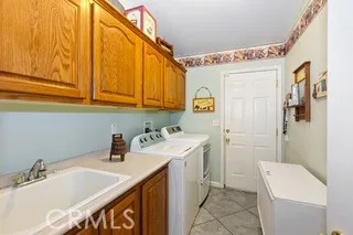 Indoor Laundry with Sink, Refrigerator and Washer/Dryer