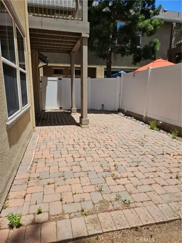 Pavers and vinyl fencing for privacy and security.