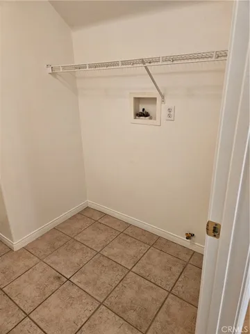 Downstairs laundry room with hookups for washer and dryer.