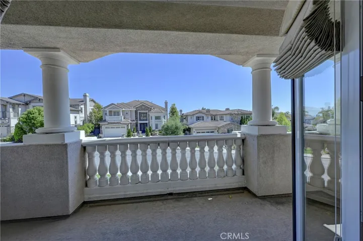 Bonus room balcony looking out to the front of the property.