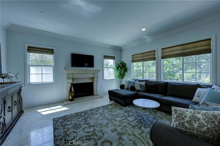 Family room with fireplace, mantle & hearth.