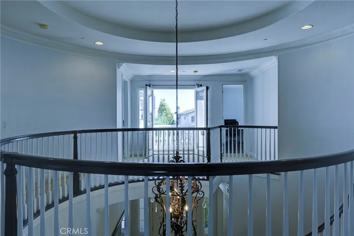 Upstairs view to the double door balcony.