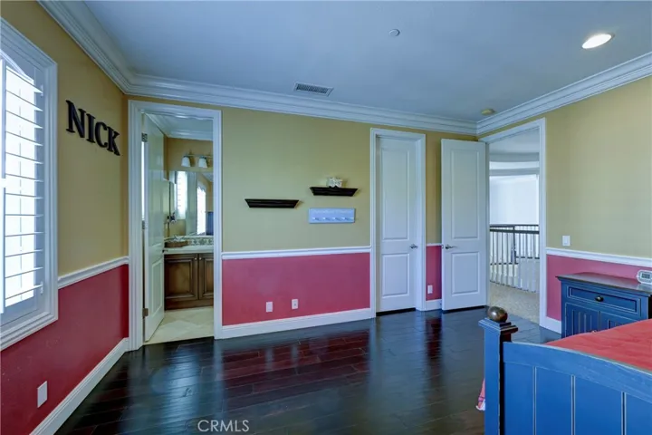 Upstairs bedroom #2 with ensuite bath and walk in closet.