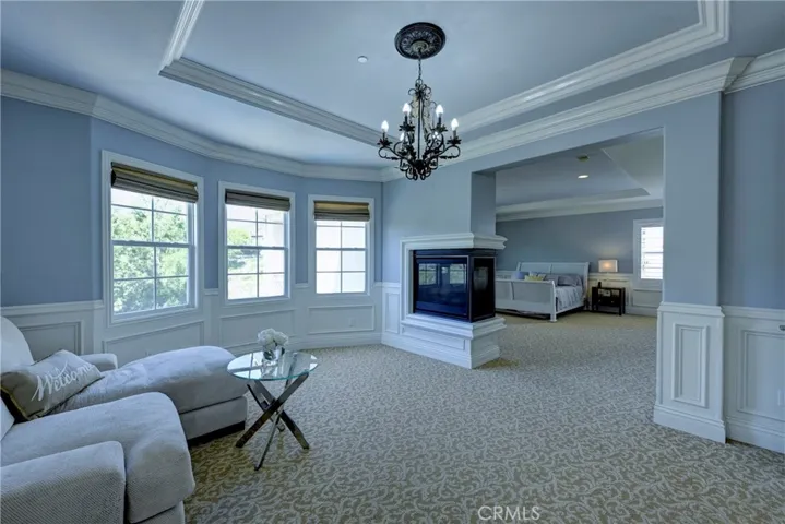 Primary retreat with two sided gas starter fireplace.