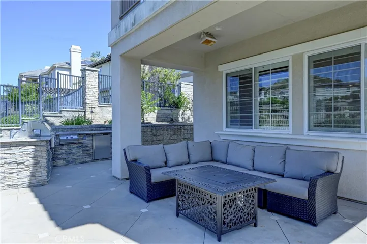 Backyard patio next to the built in kitchen with BBQ.