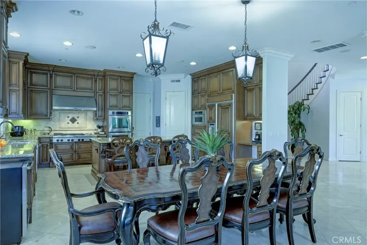Casual dining area with drop down lighting.