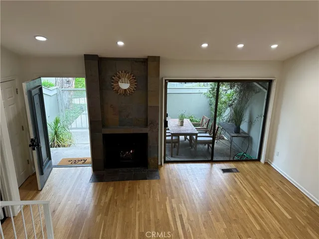 Living room with vaulted ceiling and skylights