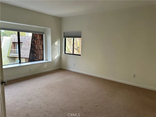 Primary bedroom with high ceilings