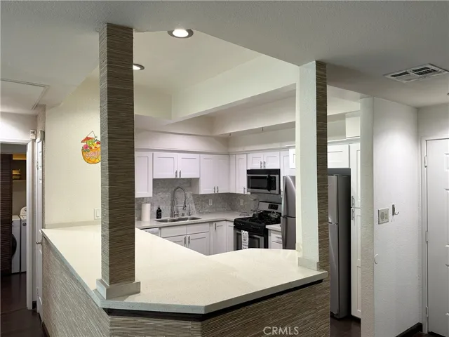 Kitchen updated, open to the living room and dining room.