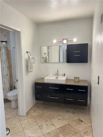 Primary bathroom with floating vanity.
