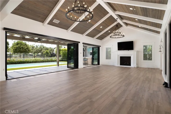 Amazing great room with wood and beam ceiling