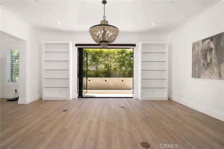 Formal dining room with bifold doors and soothing water feature